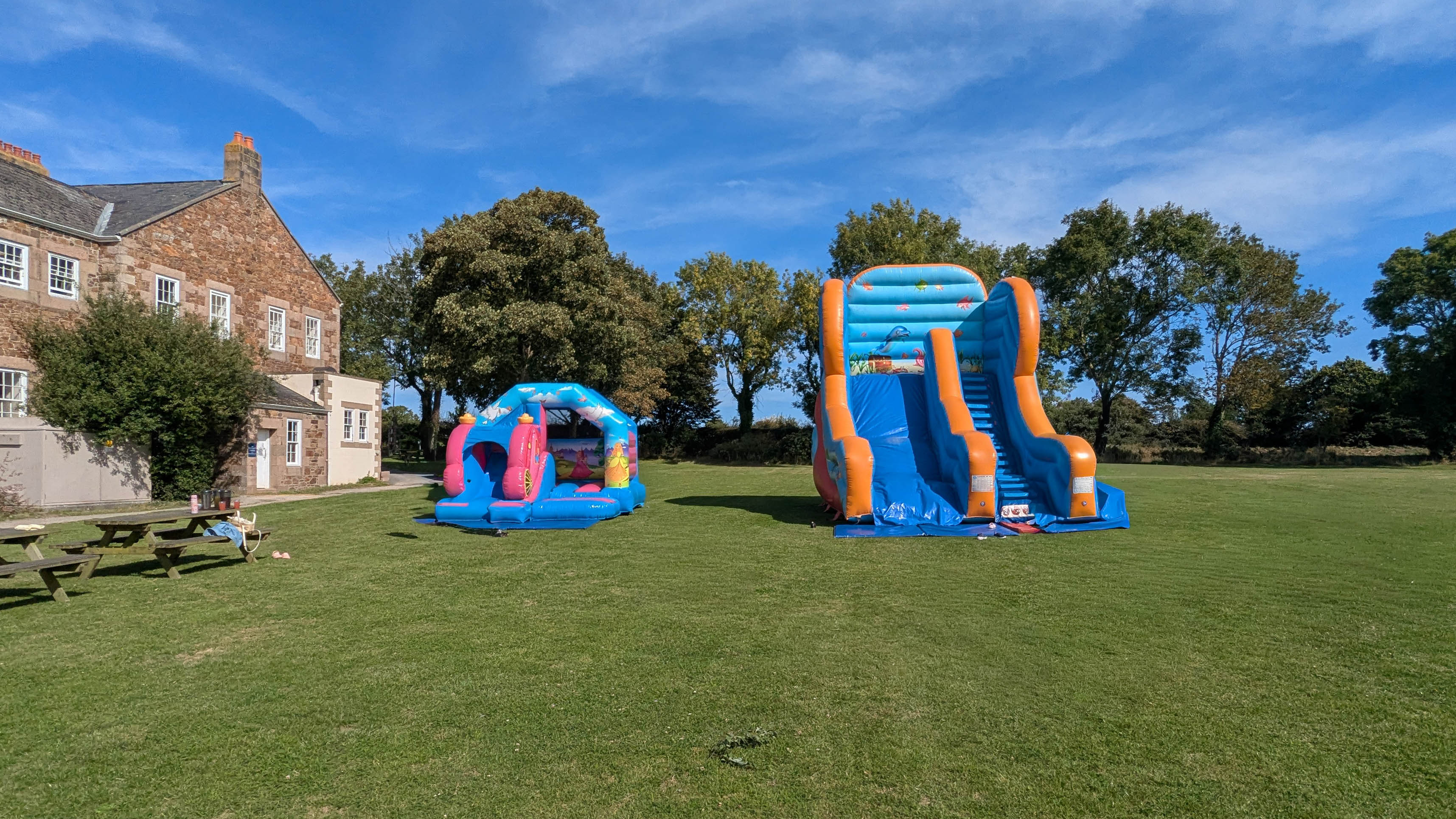 Outdoor inflatables set up on open grass area