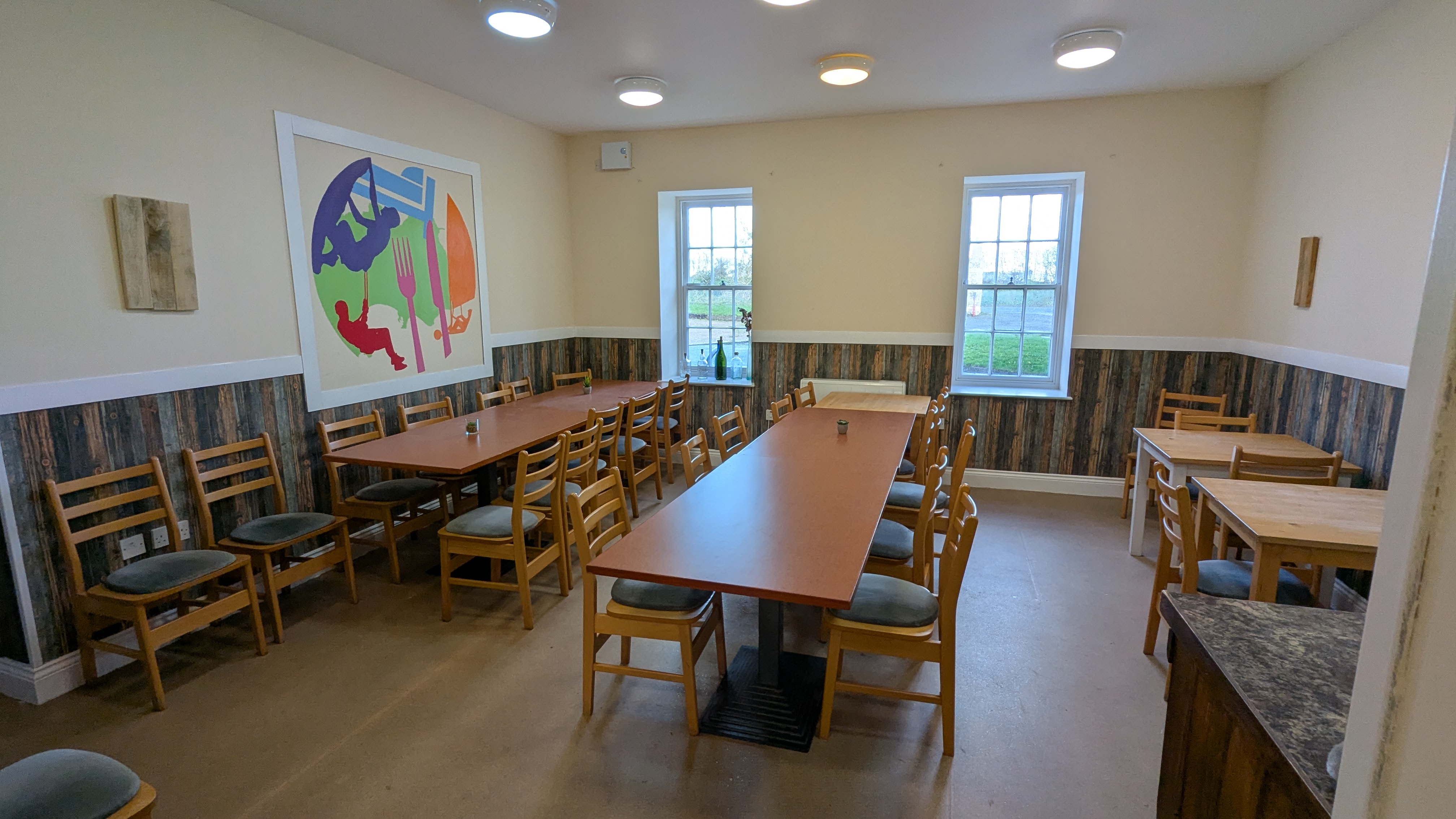Cafe seating area with tables and chairs